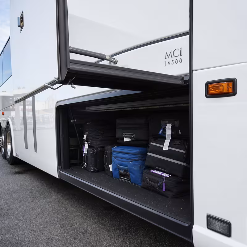 Party bus interior with wraparound leather seating and LED lighting in Milwaukee