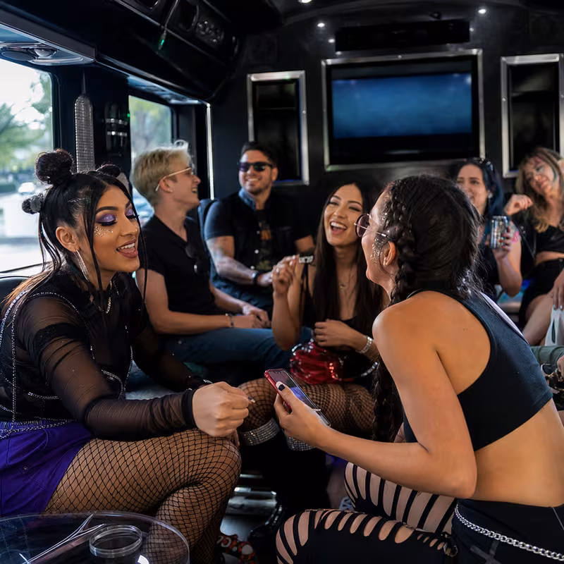 Passengers loading luggage while boarding an Milwaukee group shuttle