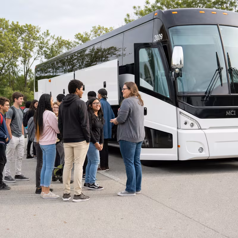 Black Mercedes Sprinter van staged for an Milwaukee School Transportation group