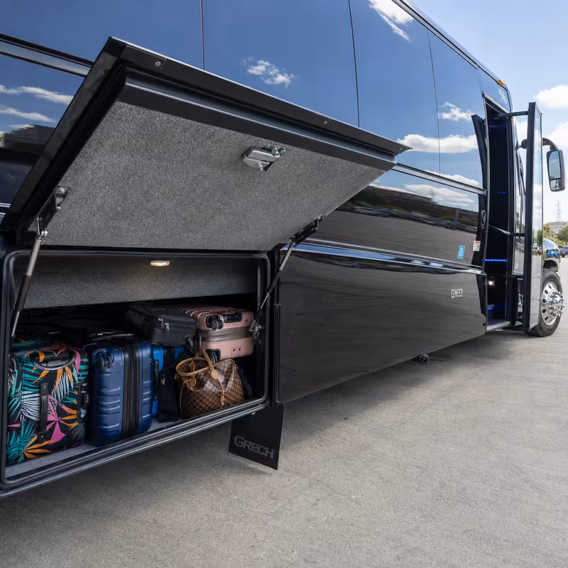 Party bus interior with wraparound leather seating and LED lighting in Milwaukee