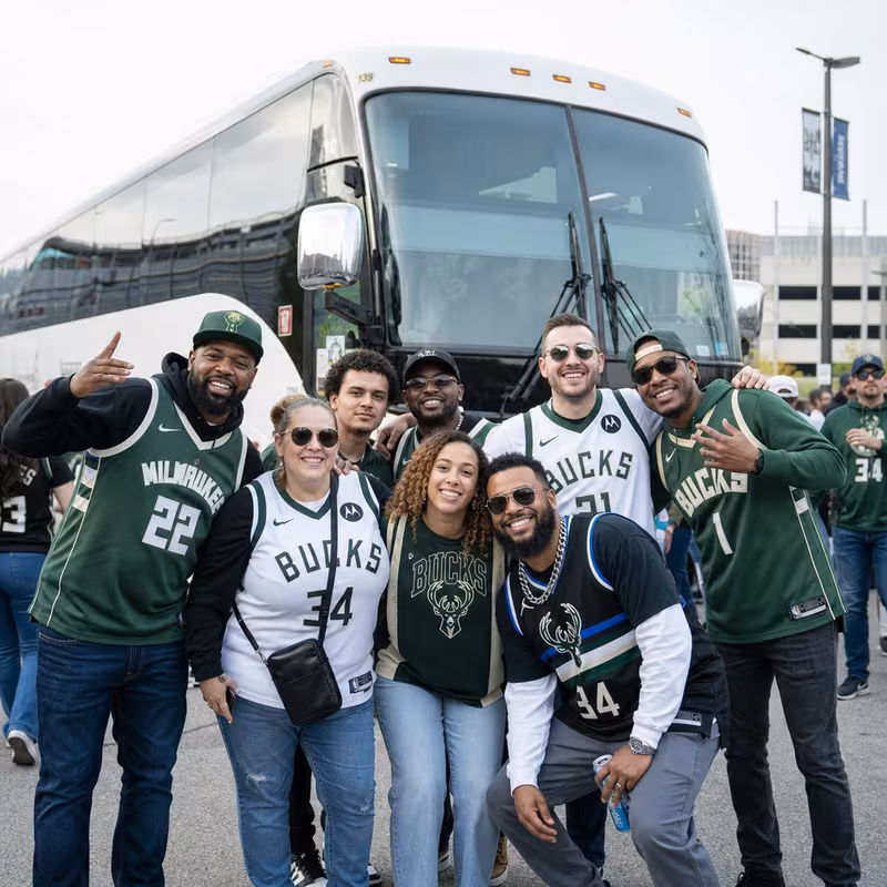 Passengers loading luggage while boarding an Milwaukee group shuttle